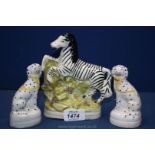A pair of Staffordshire Dalmatians and a Staffordshire Zebra