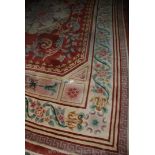 A brown ground Chinese floral Rug, 12' 8" x 8' 11".