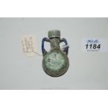 A rare Roman glass bi-colour glass perfume bottle, the body of pale green colour,