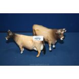 A Beswick Jersey Bull and cow