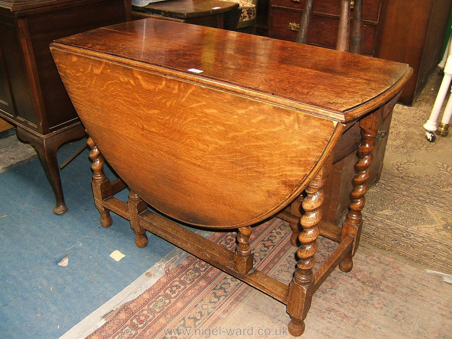 An Oak dropleaf Table with barley twist legs