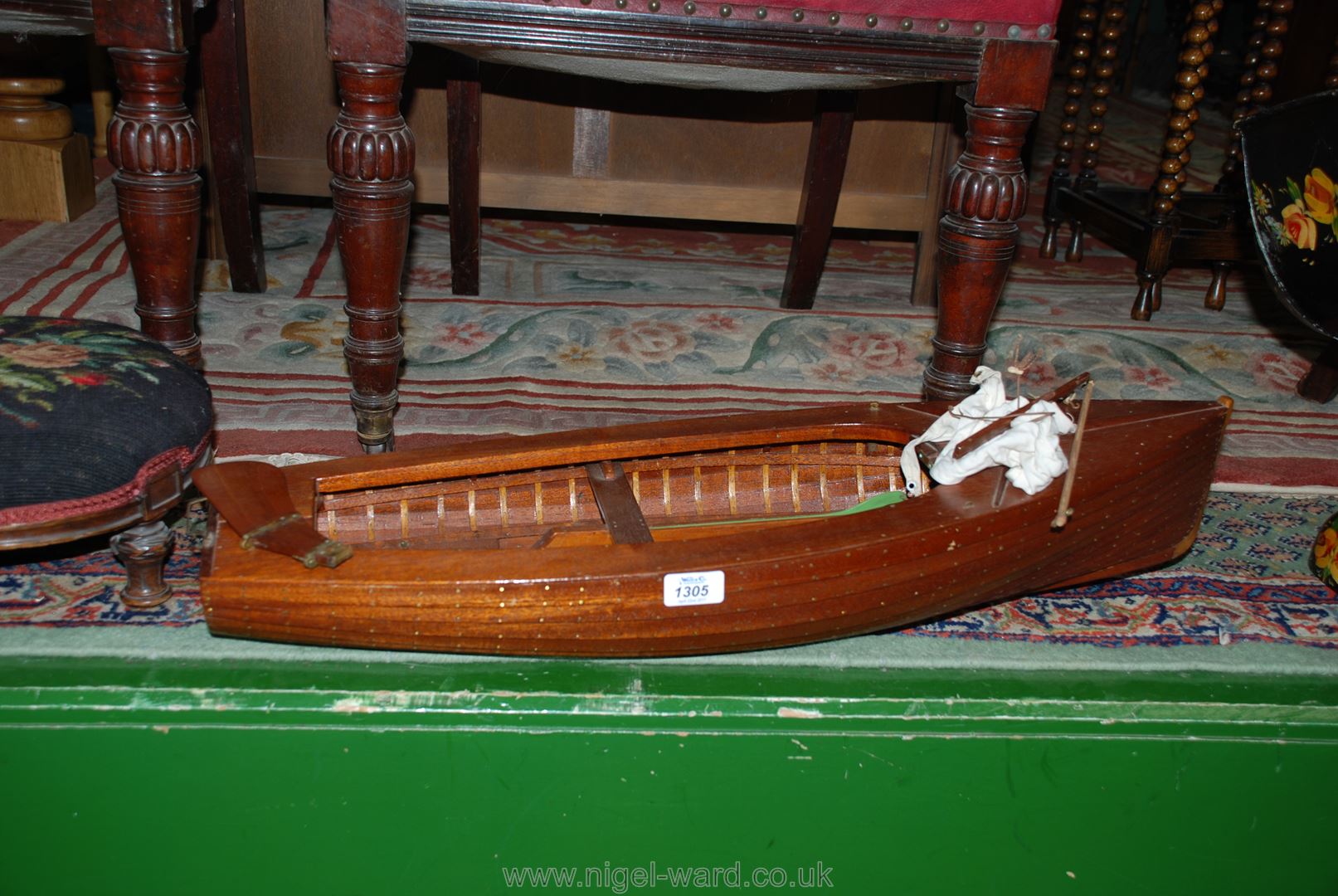 A large scratch made Sailing Boat approx 2 1/2' long includes sail and rudder