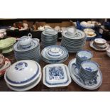 A 1930's Chinese porcelain blue and white dragon rice grain Dinner Service comprising 15 large,