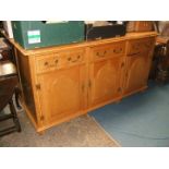 A modern light Oak Dresser Base, having moulded edge, three plank top,