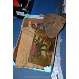 A box of miscellanea including a plaque depicting George and the Dragon, a wire turtle frame,