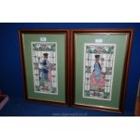 A pair of framed and mounted cross stitch pictures of scenes from a stained glass window