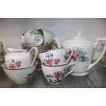 A rose decorated Teaset made in Czechoslovakia including teapot, milk jug, sugar bowl,