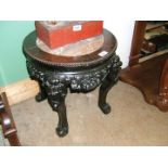 An oriental circular hardwood Occasional Table having circular top with marble insert,