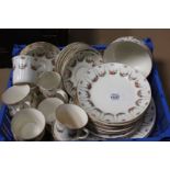 A vintage Tea Service with floral decoration including nine small teacups (some as found),