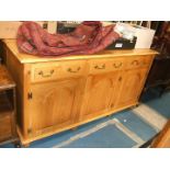 A modern light Oak Dresser Base, having moulded edge, three plank top,