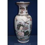 An Oriental Vase decorated with flowers and storks,