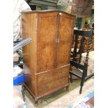 A reproduction Queen Anne style Walnut finished Tallboy, having arch top with carved cornice,