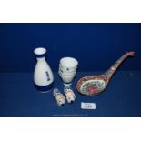 A Japanese Blue and White Sake Set, a Chinese Spoon Stand & a Pair of Miniature Delft Clogs.