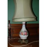 A pretty hand-painted porcelain Lamp base with cast metal base and rim,