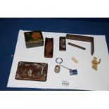 A small Oriental carved Figure (bone), a broken inlaid Oriental Box, Miniature Lighter,