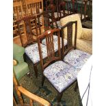 A set of four elegant art nouveau Dining Chairs having curved top rail,