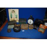 A quantity of old tins, metal picture and Hughes family Scales,