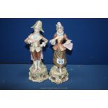 A pair of Continental male and female Figures dressed in 18th c.