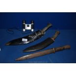 A German WWII bayonet, two Gurkha Kukri knives and a pair of National Trust,