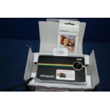 A Polaroid Z2300 Instant Print and film,