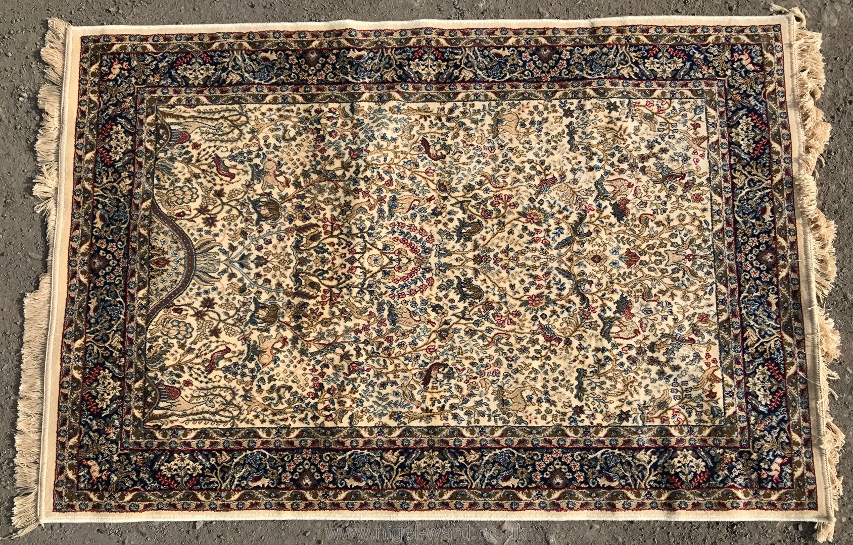 An Ivory ground Kashmir Rug,