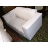 A white upholstered Sofa