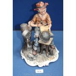 A Capo-di-monte Figure of a man repairing pots and pans,