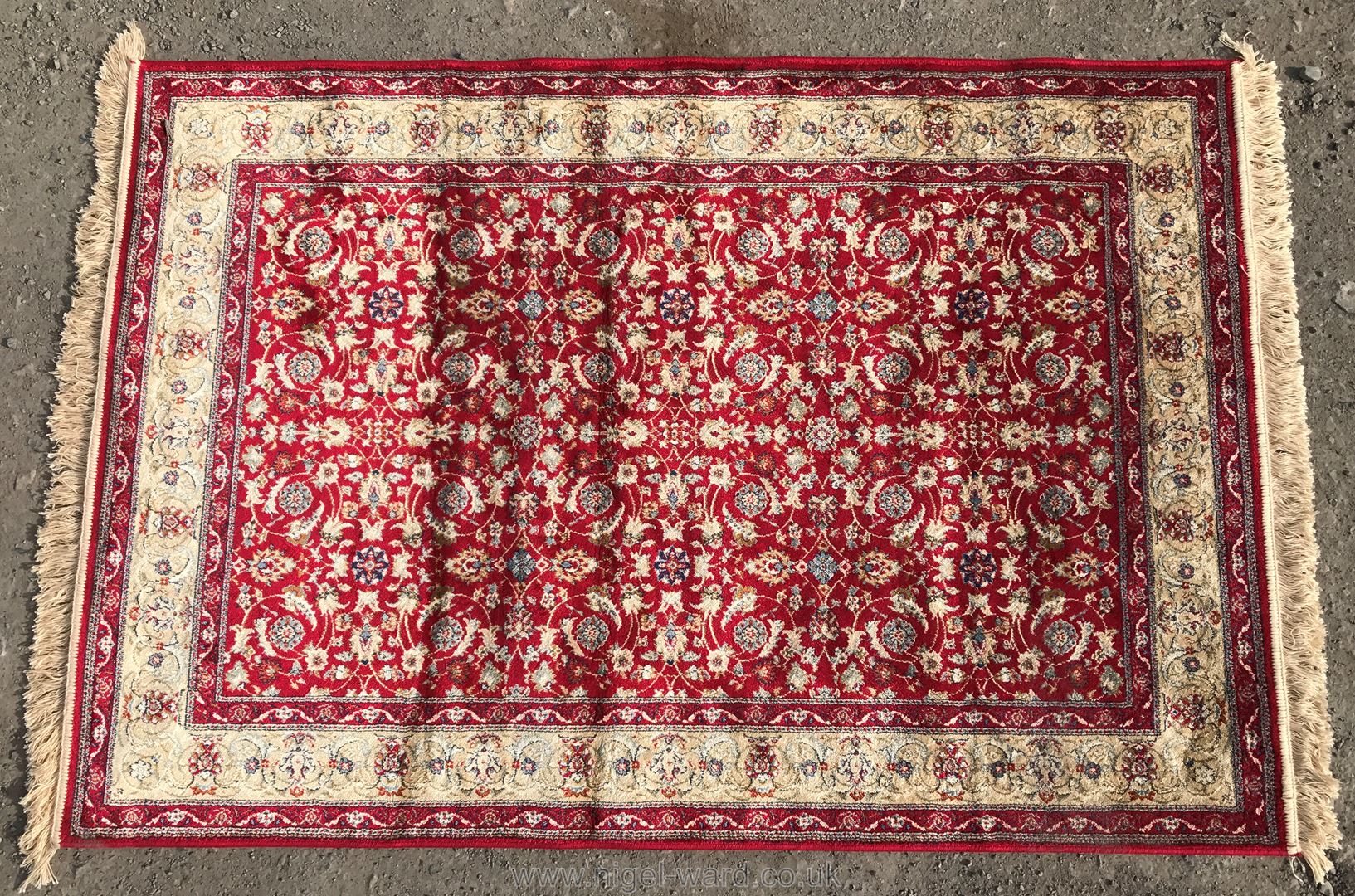 An ivory ground Kashmir Rug,