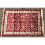 An ivory ground Kashmir Rug,