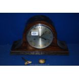A Napoleon hat mantle clock with pendulum and key
