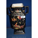 A ceramic two handled Vase with a Venetian scene on a black background with gilt highlights,