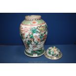 A Famille Verte Chinese Baluster Jar and lid with well painted scenes of warriors,