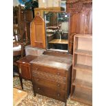 A good 1940's Oak Dressing Chest having rectangular mirror, in shaped top frame,