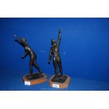 A pair of Bronze Figures of Male and Female Athletes, 12 3/4" tall,