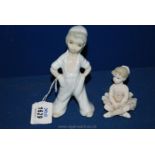 A Bisque Porcelain Figure of a Ballerina and a Spanish Porcelain Figure of a Boy in Overalls Arms