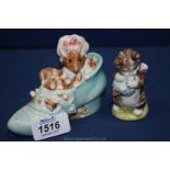 Two Beatrix Potter figures 'Old Woman in a Shoe' and 'Miss Moppet'.