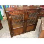 A reproduction Oak two door Bookcase,