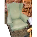 A late Georgian wing back fireside upholstered Armchair with hump back, tight wings,