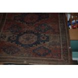 A Large Knotted Turkish Rug 127" x 97", well worn.