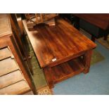 A modern heavy hardwood Coffee Table, plain rectangular top, plain frieze,