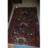 A hand knotted Tribal Rug with animal decoration including Deer, Birds,
