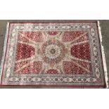 A red ground Silk Rug,