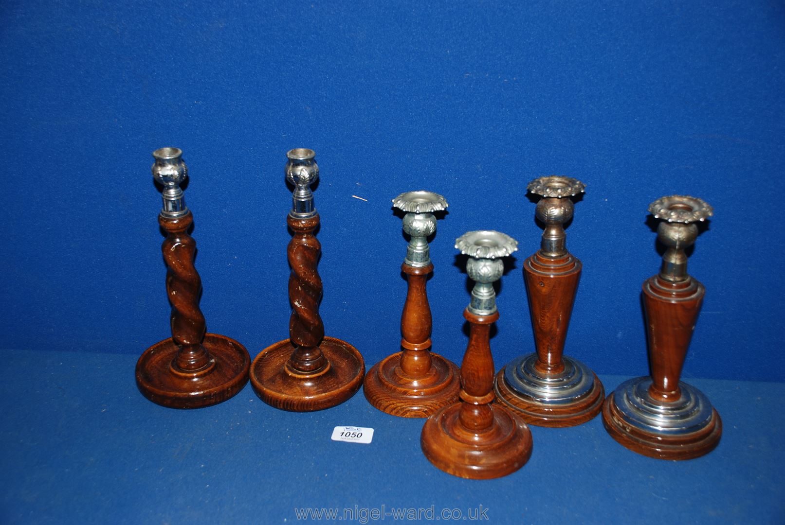 Three pairs of Treen Candlesticks including barley twist and conical shapes