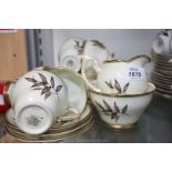 A Salisbury bone china cream and gold colour Teaset with leaf decoration including six cups,