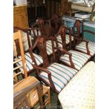 A set of six reproduction Sheraton style Dining Chairs including two carvers,