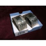 A pair of D-shaped Silver Napkin Rings