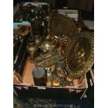 A quantity of brass and copper including vases, egg cup and stand, door stops, trays,