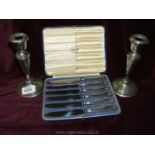 A pair of Silver Candlesticks and a boxed set of Silver handled butter Knives by Low & Son,