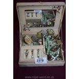 A Jewellery Box containing costume jewellery including green beads, silver brooch, rings,