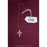 A Gold and opal Cross and chain
